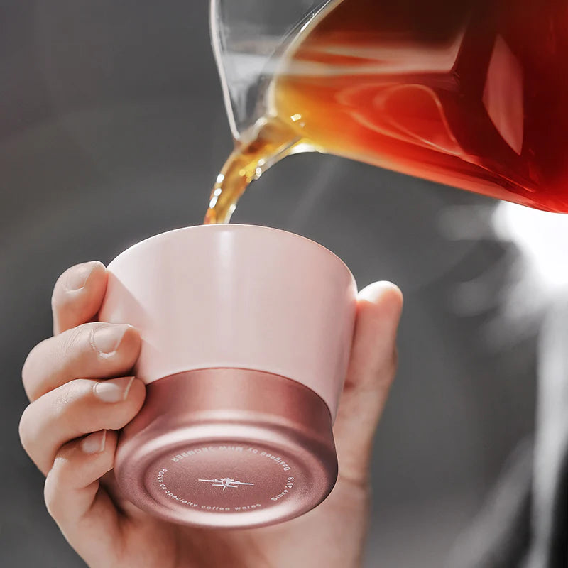 MHW-3BOMBER pink CERA ceramic coffee cup being filled. Features U-shape and color-blocked design.