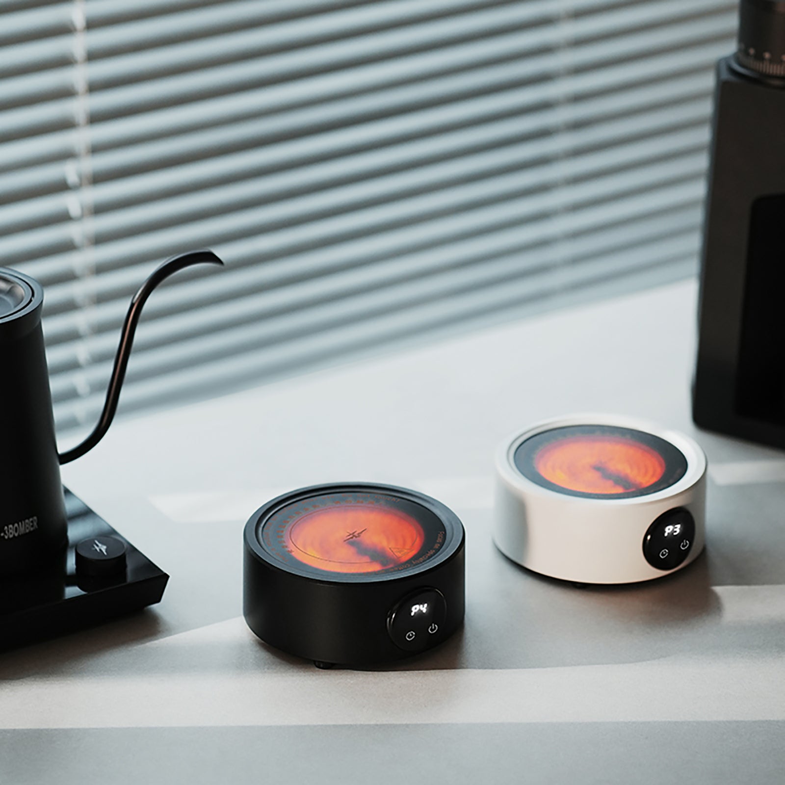 MHW-3BOMBER electric coffee heaters: black & white mini stoves for moka pots. Compact, portable, with temp control.