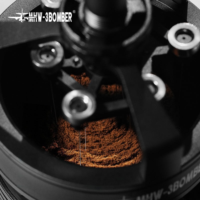 The MHW-3BOMBER YU Series Cyclone Needle Distributor WDT Tool, featuring a matte black finish with visible screws and an airplane logo, is designed for espresso precision in coffee grinding, ensuring even distribution of the finest grounds.