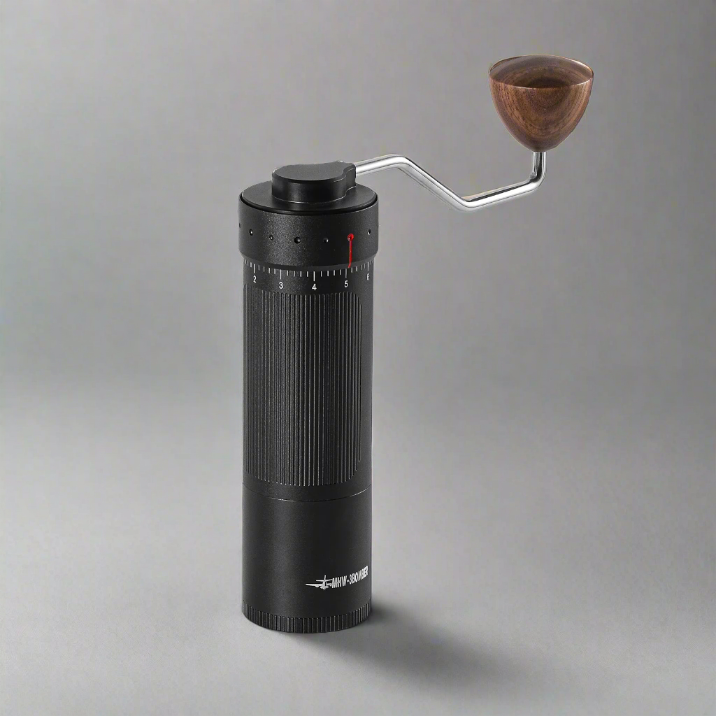 Close-up image of the MHW Bomber R3 manual coffee grinder, showcasing its sleek design, durable build, and precision grinding mechanism.