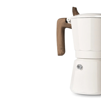 A glimpse of the MHW-3BOMBER Double Valve Moka Pot 100ml with a wooden handle on a white background showcases its sturdy design, suitable for many stovetops. Ideal for craft coffee lovers, only the right side is visible.