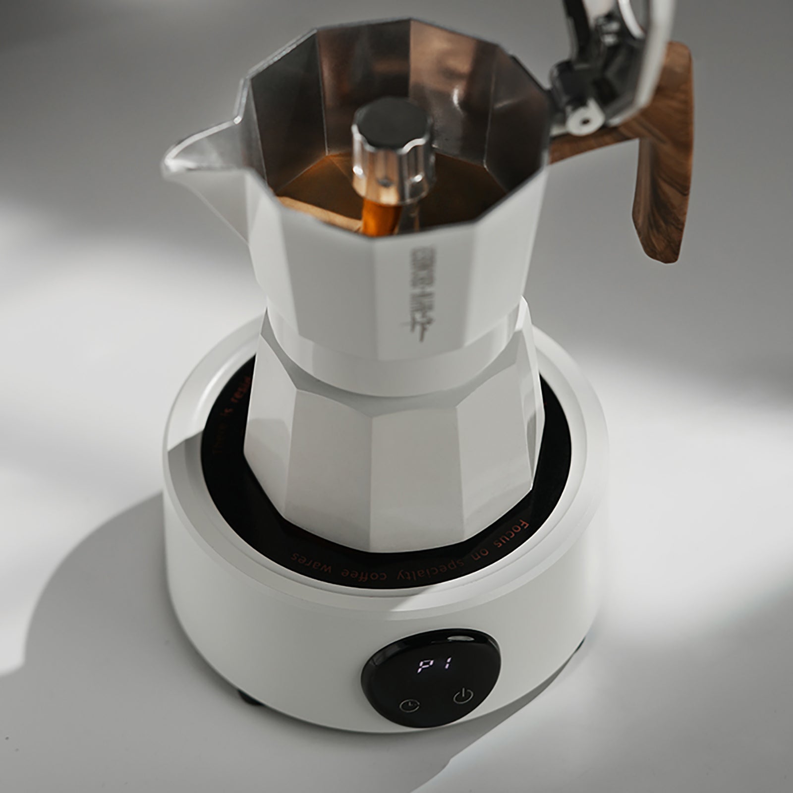 MHW-3BOMBER electric Moka pot on heater. White, with wood handle.  Modern design. Coffee brewing. 