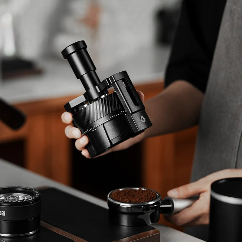 MHW-3BOMBER black SE Pro Needle Distributor WDT tool in hand. For espresso puck prep, with magnetic install.