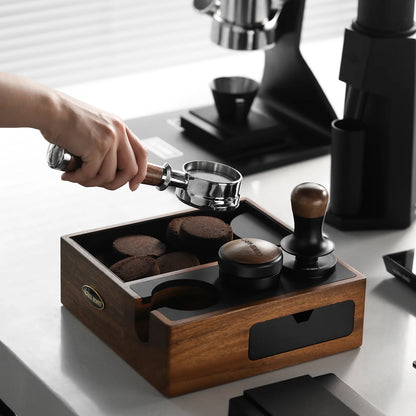MHW-3BOMBER knock box station with portafilter and tamper, walnut wood finish. Espresso making on counter.