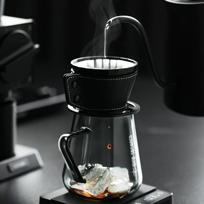 MHW-3BOMBER Meteorite dripper with black holster. Clear glass carafe with ice. Pour over coffee.